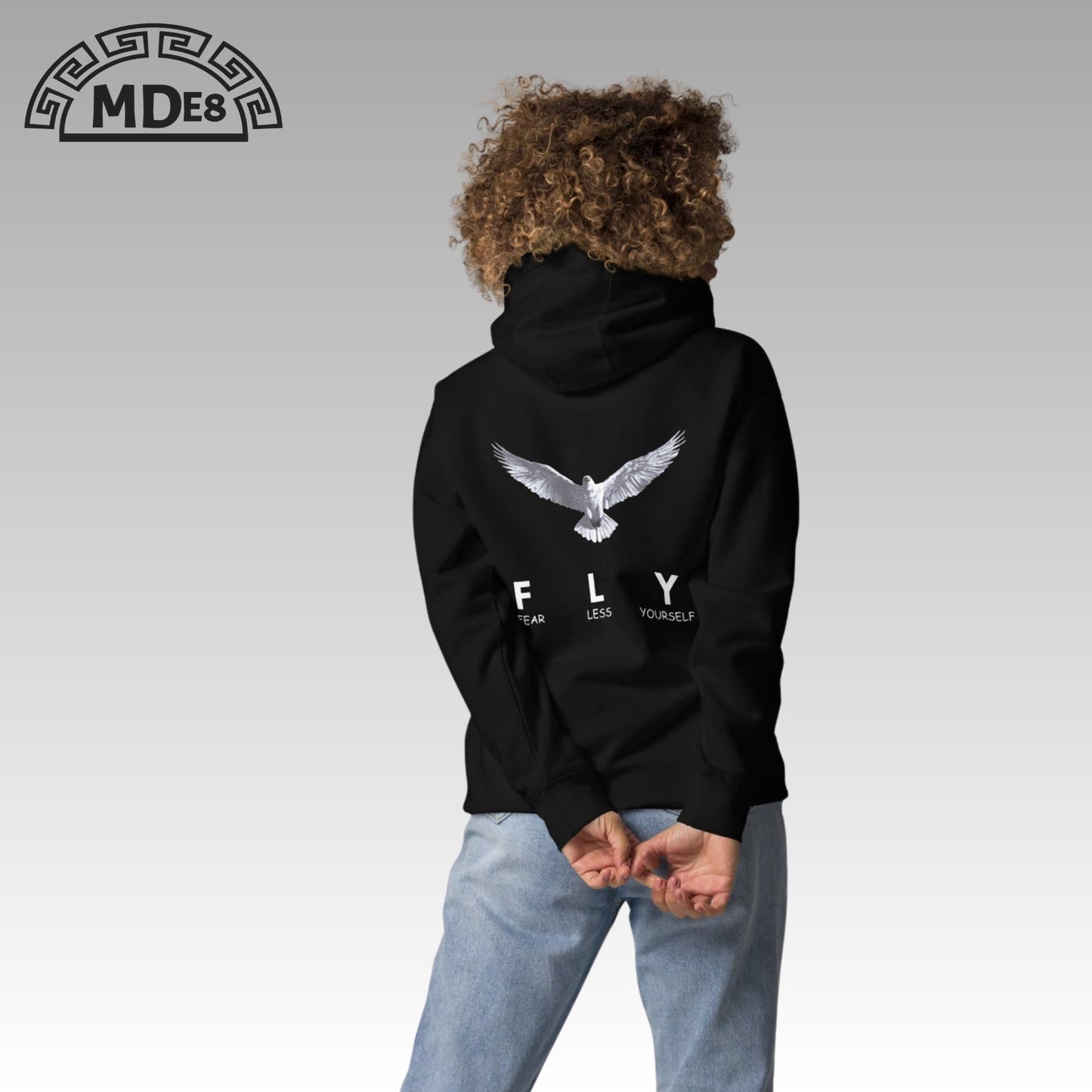 Model wearing FLY Hoodie – minimalist unisex streetwear design