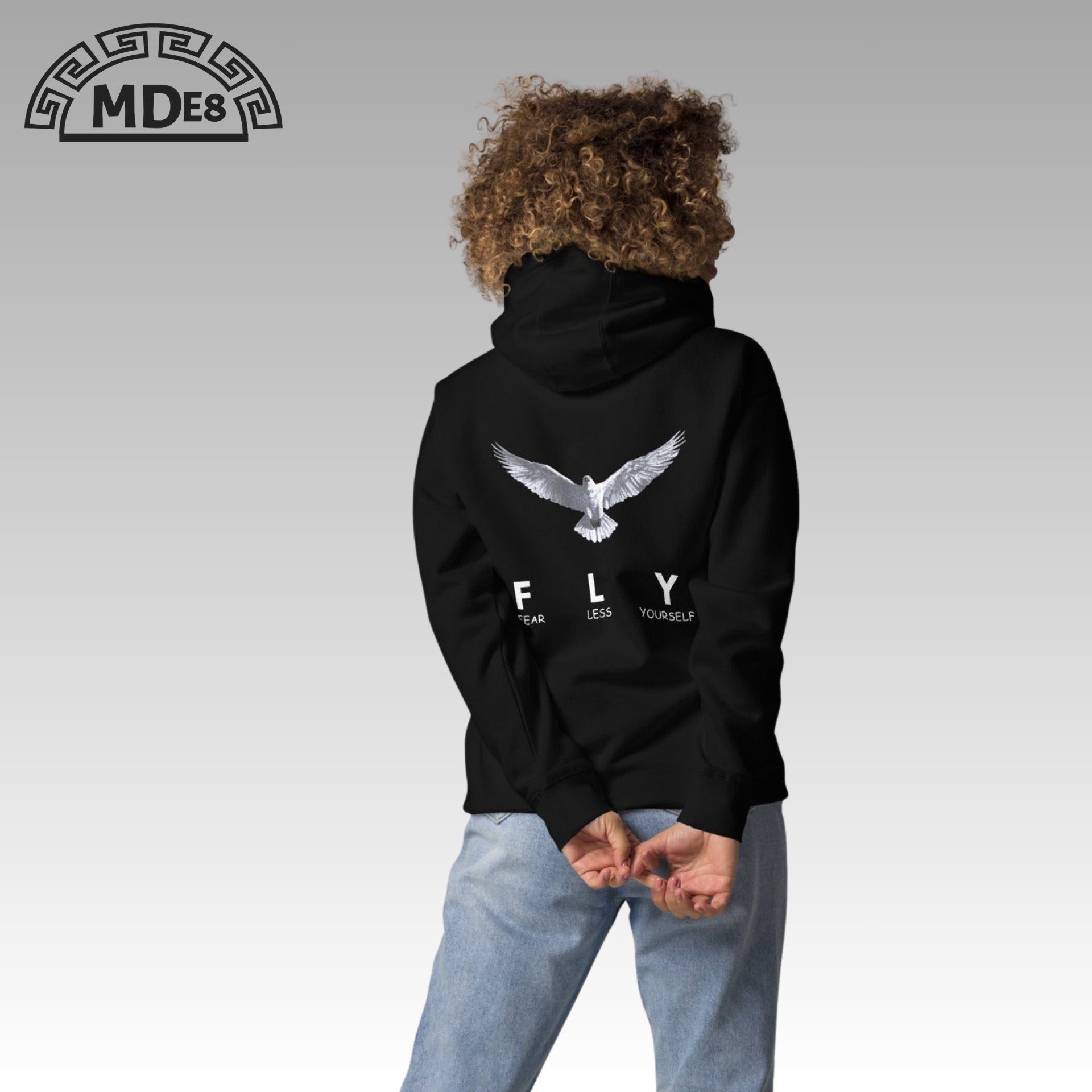 Model wearing FLY Hoodie – minimalist unisex streetwear design
