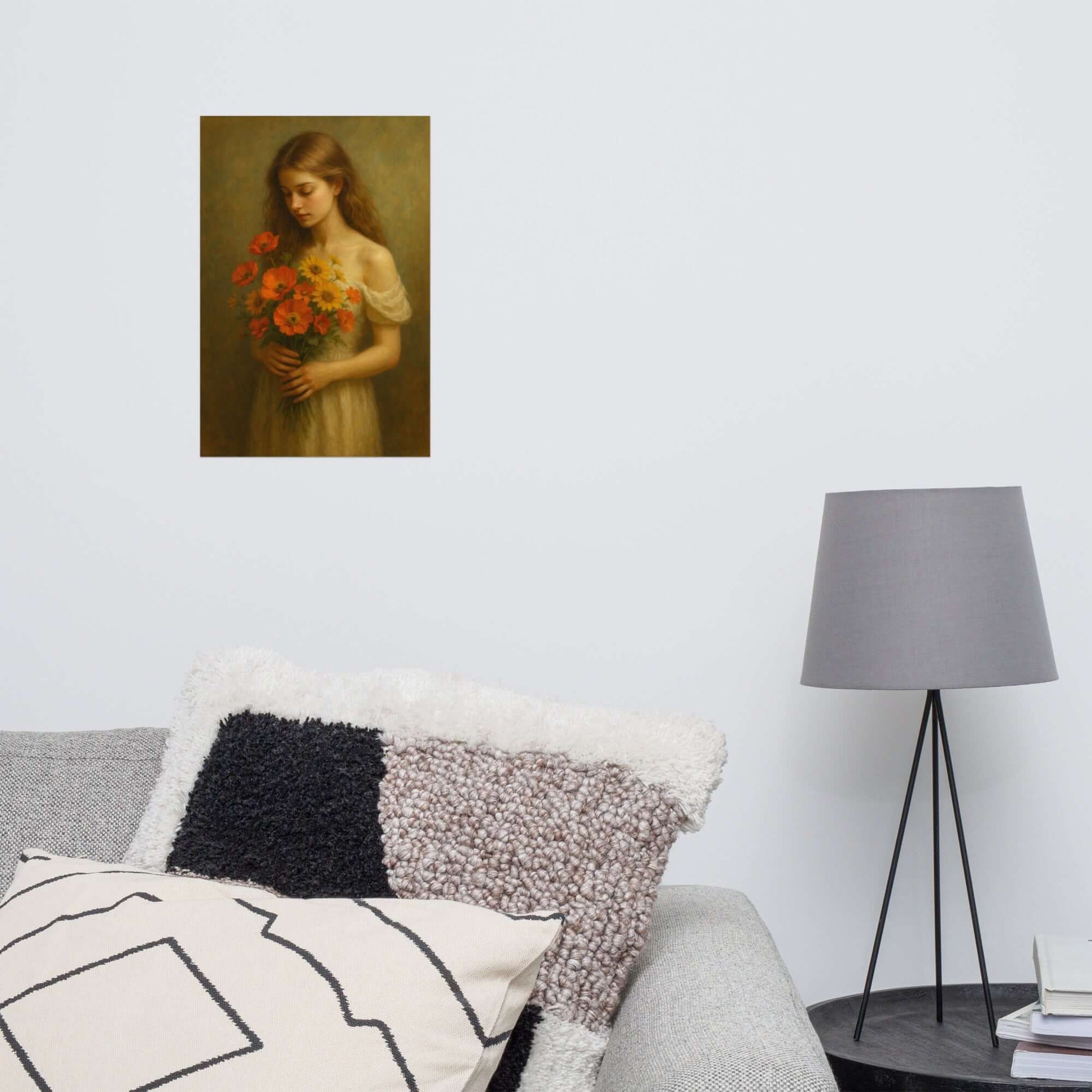 Decorative pillows on a sofa with a lamp and framed painting in the background